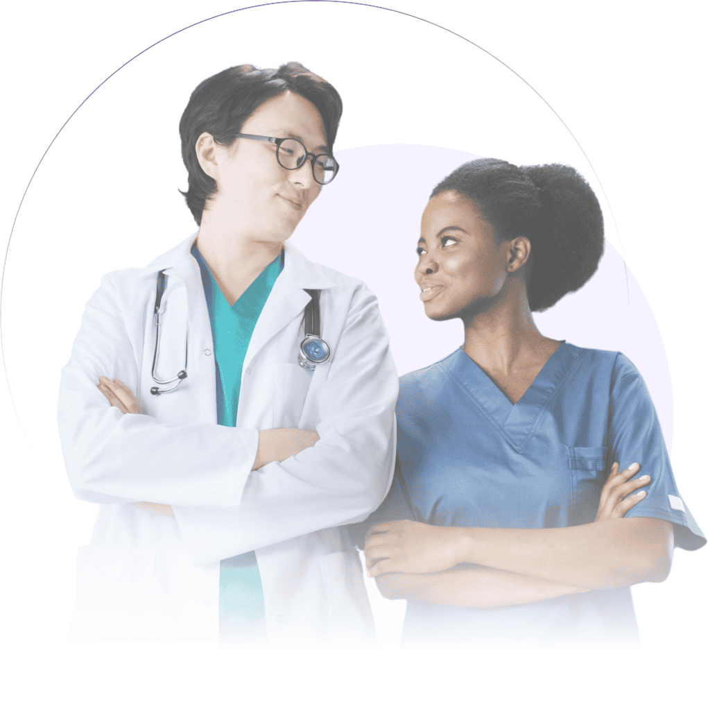 Two healthcare professionals, a man in a white coat with a stethoscope and a woman in blue scrubs, stand with arms crossed, looking at each other, exemplifying the strong partnership essential in primary care.
