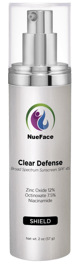 Bottle of NueFace Clear Defense Broad Spectrum Sunscreen SPF 45 with Zinc Oxide 12%, Octinoxate 7.5%, and Niacinamide. Contains 2 oz (57 g).