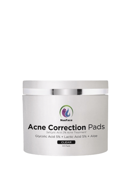 A jar of NueFace Acne Correction Pads with salicylic acid, glycolic acid 5%, lactic acid 5%, and aloe. Contains 60 pads and labeled as "CLEAR.