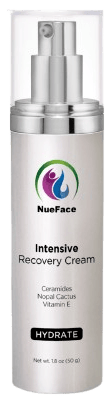 A bottle of NueFace Intensive Recovery Cream, featuring ceramides, nopal cactus, and vitamin E. The bottle is white with a silver pump and black "HYDRATE" label.